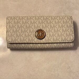 Gently used in good condition Michael Kors Beige Monogram Wallet